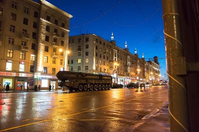 Topol-M missile launchers on a city street at night in Moscow, Russia.