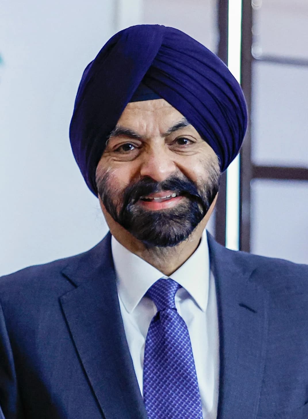 Ajay Banga, President of the World Bank, smiling and looking forward.