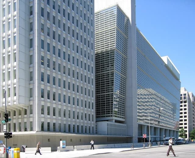 Exterior view of the World Bank building in Washington D.C. on a sunny day.