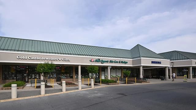 Exterior view of Gold Castle Jewelers storefront in a shopping plaza.