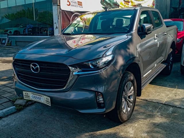 2023 Mazda BT-50 3.0 Standard 4x2 in Concrete Gray parked on concrete.