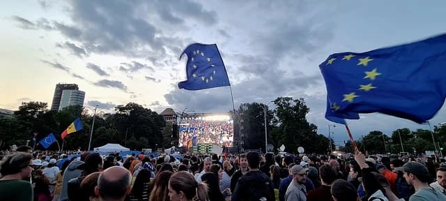 Crowd of people attending a Nicușor Dan campaign rally in Bucharest, Romania.