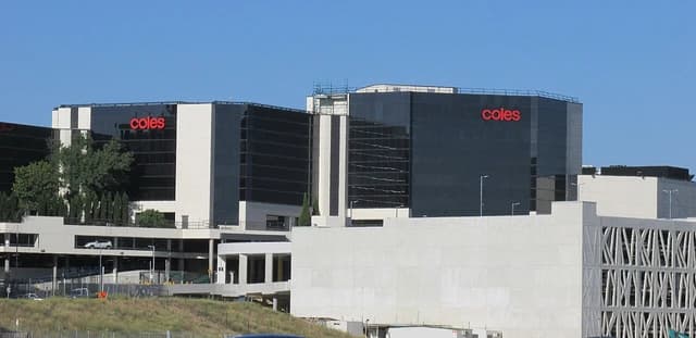 Coles Group headquarters building with 'coles' logos visible on the facade.