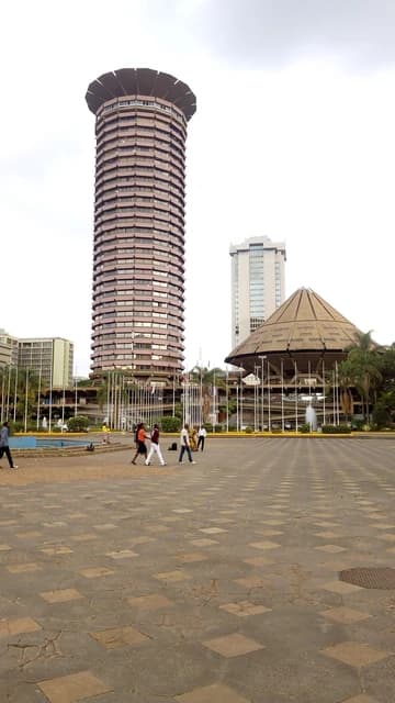 Exterior view of the Kenyatta International Conference Centre (KICC) on a cloudy day.