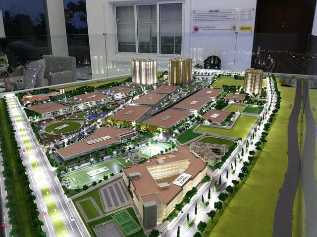 Detailed architectural scale model of a large residential and commercial development.