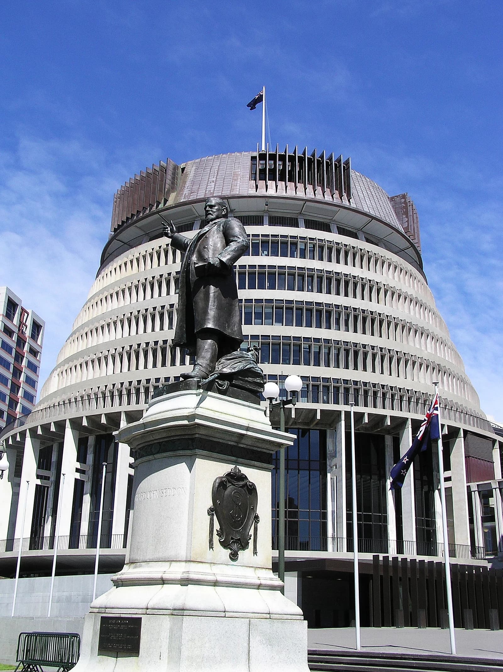 The Beehive, New Zealand Parliament Building, with a statue of Richard John Seddon in the foreground.
