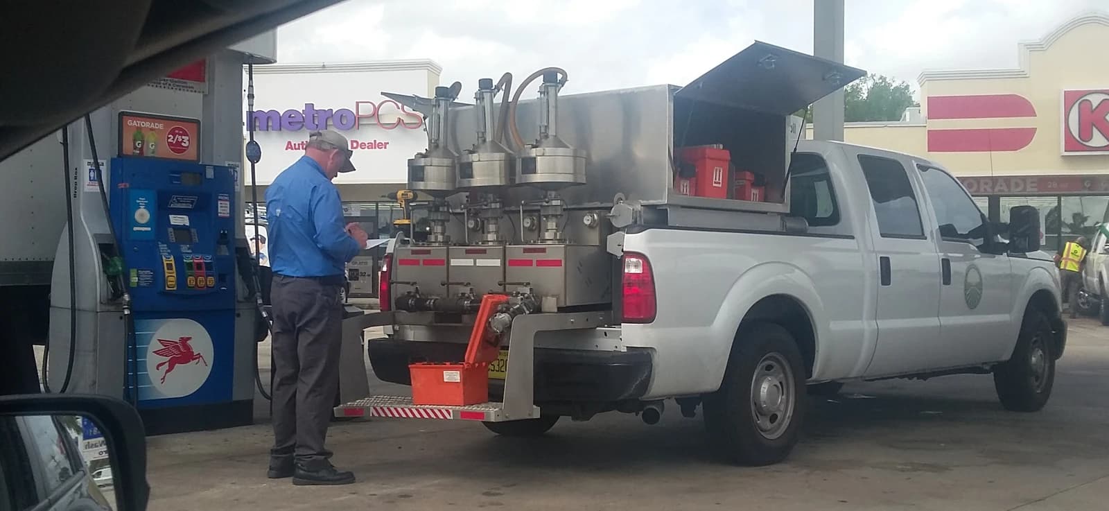 Petroleum inspector checks accuracy of fuel dispensers at a Florida gas station.