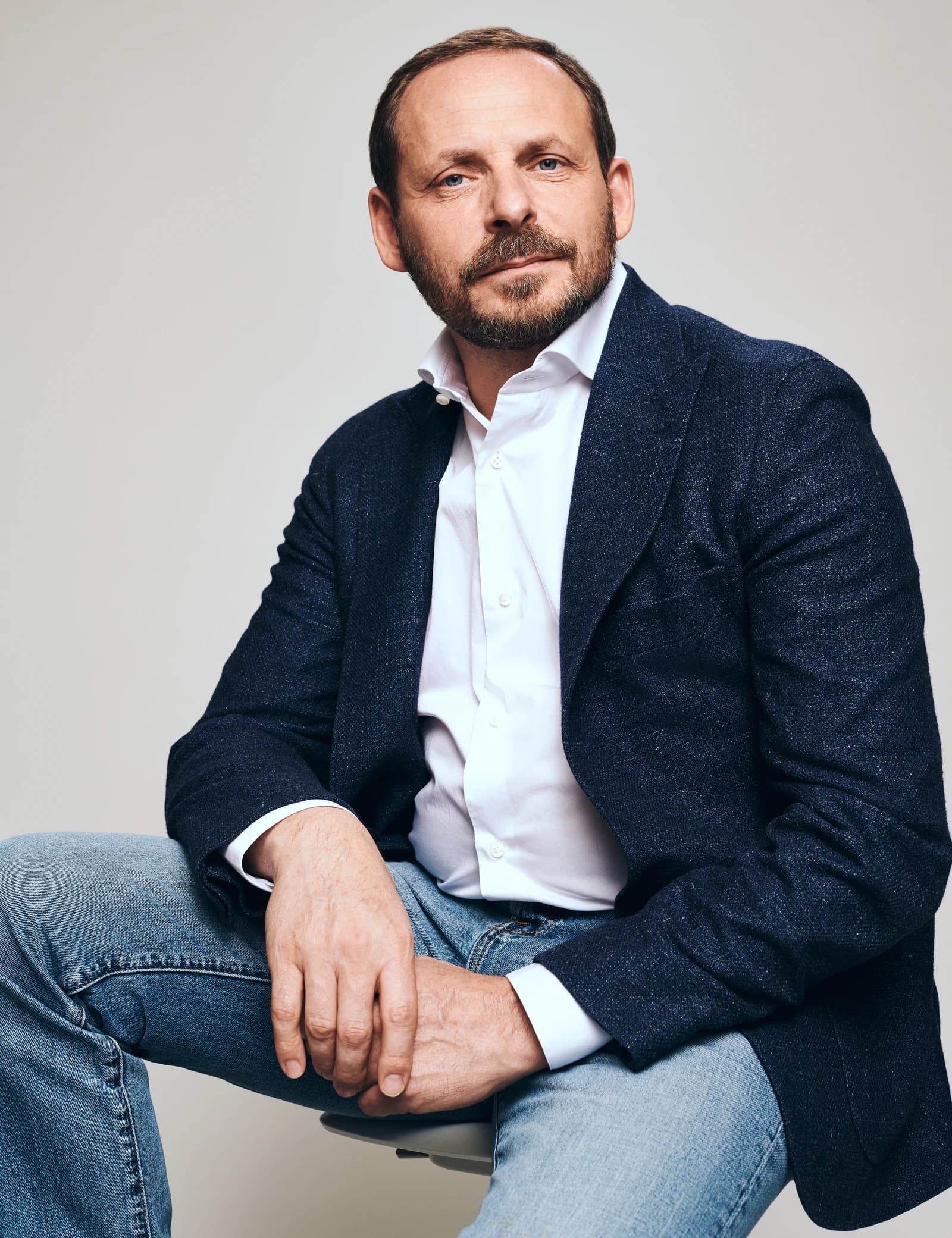 Arkady Volozh, co-founder of Yandex, seated and looking directly at the camera.