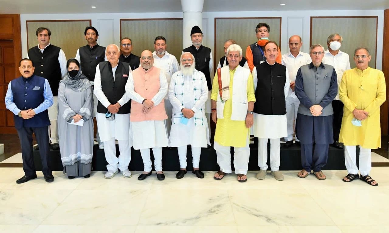 Indian Prime Minister Narendra Modi and other political leaders standing together for a group photo.