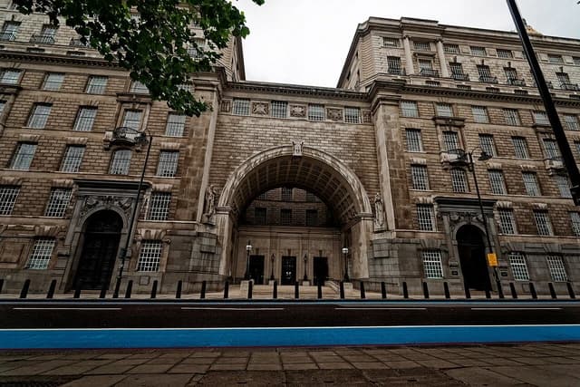 Thames House, MI5 Headquarters building in London, featuring arched entrance.