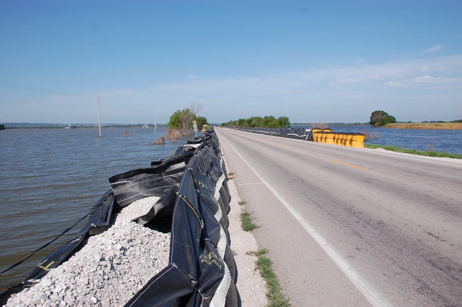 Flood barrier protecting a road from rising river waters in Blair, Nebraska.