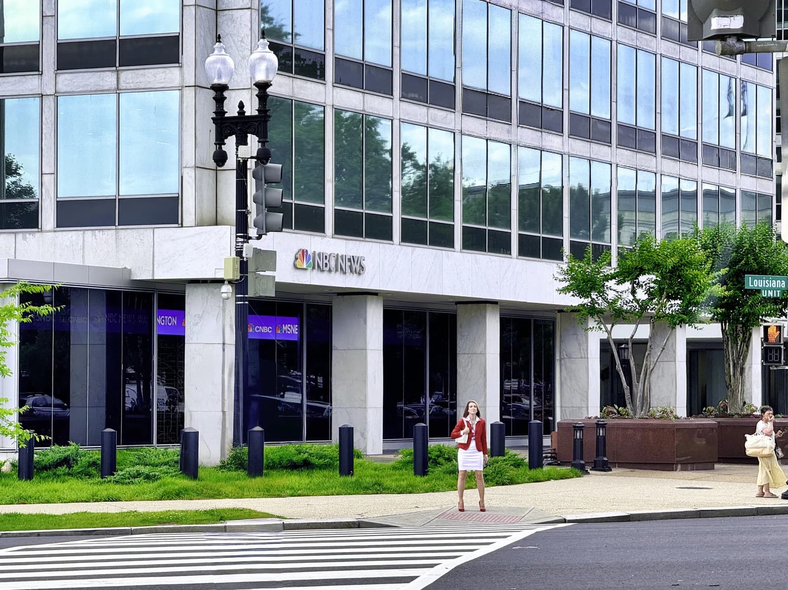 Exterior view of the NBC News building in Washington, D.C. with street and sidewalk.