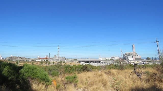 Kwinana Lithium Plant and Waste to Energy Plant, Western Australia, under blue sky.