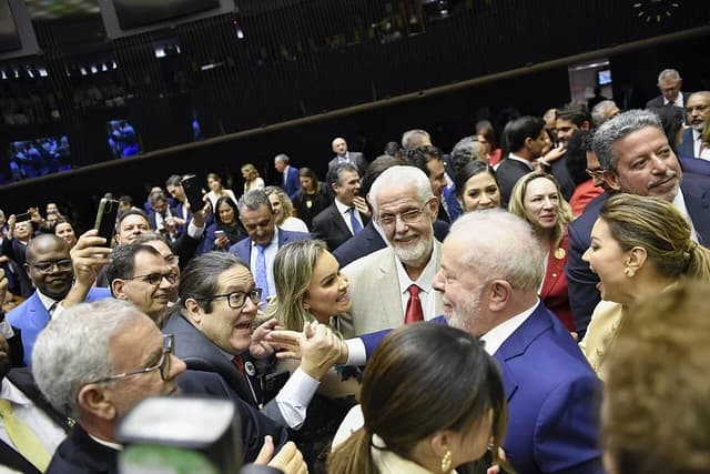 Luiz Inácio Lula da Silva, President of Brazil, surrounded by people at an event.