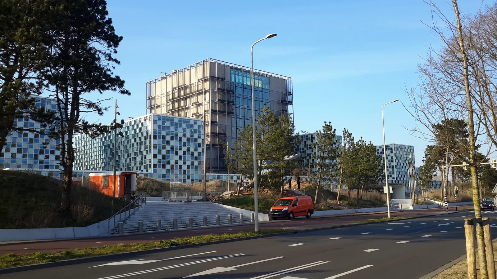 International Criminal Court Headquarters building in The Hague, Netherlands, with a road in the foreground.