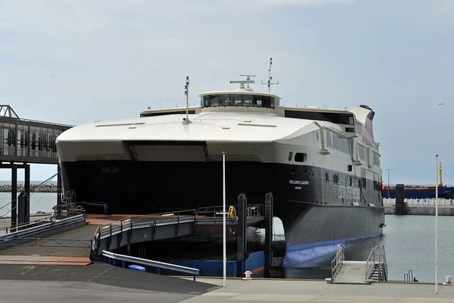 Ferry 'Villum Clausen' docked in the port of Rønne, Bornholm, on a cloudy day.