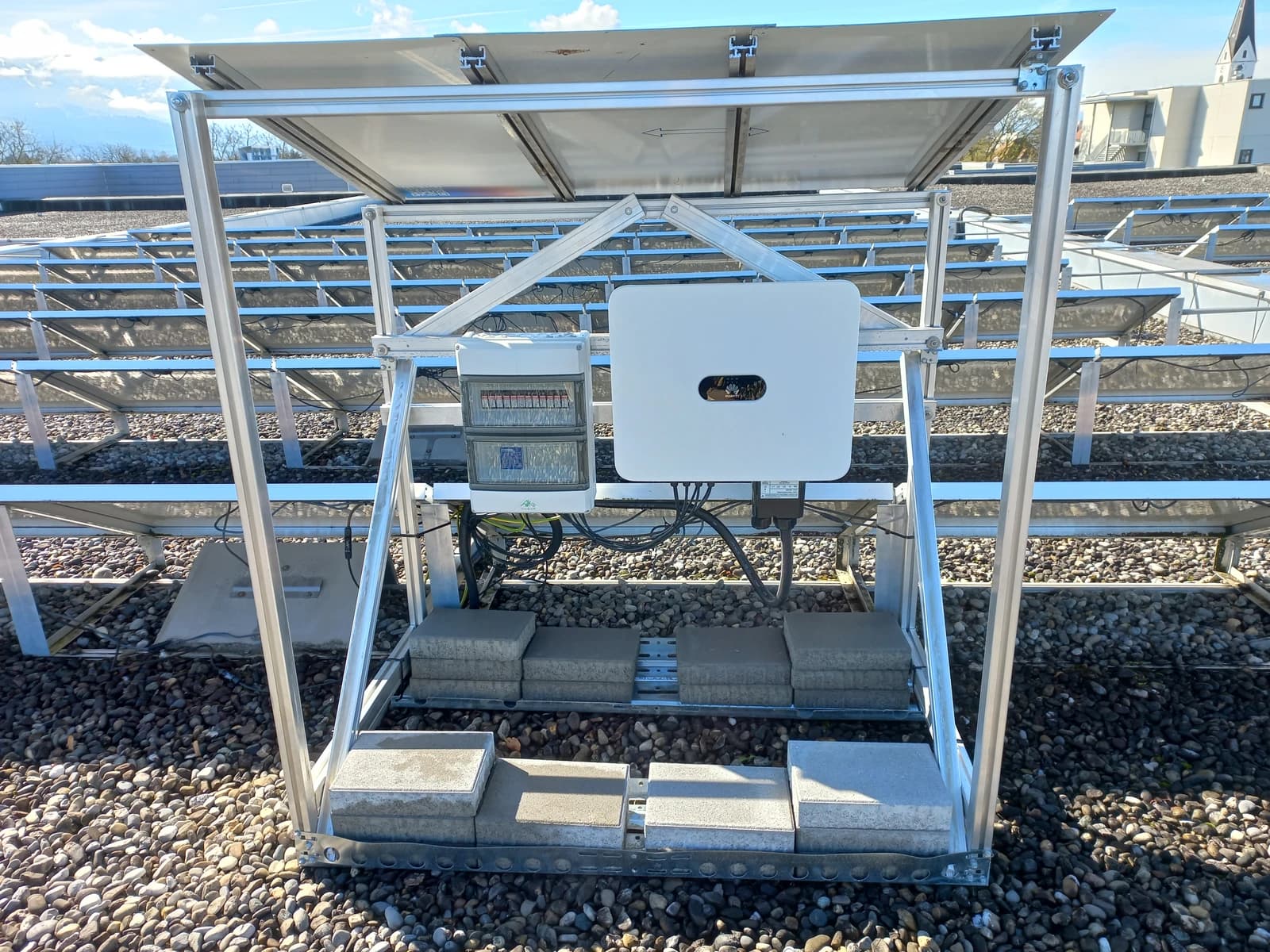 Solar inverter and DC surge protection device installed on a rooftop solar panel array.