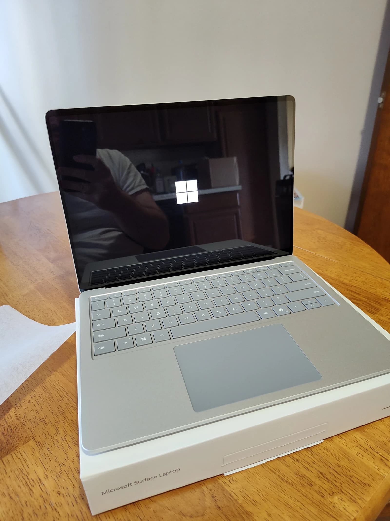Microsoft Surface Laptop 7 with the Windows logo displayed on its screen.