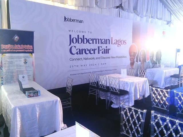 Jobberman Lagos Career Fair banner displayed at an event with an adjacent booth.