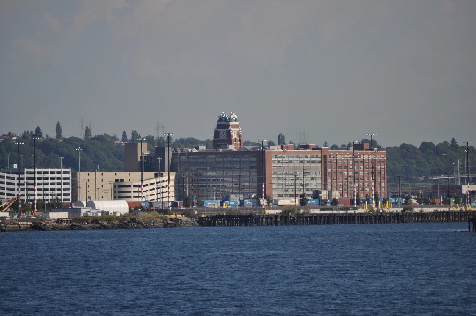 The Starbucks Center building in Seattle, Washington, viewed across a body of water.