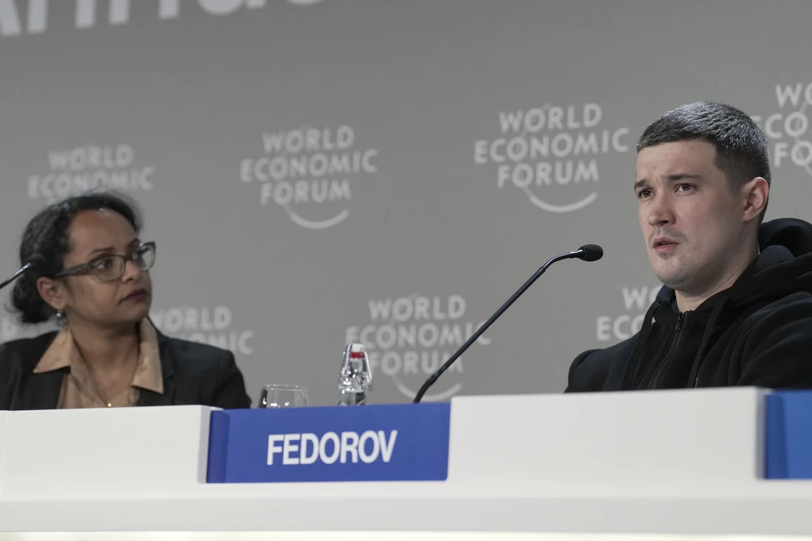 Mykhailo Fedorov, Ukrainian Vice Prime Minister, speaks at a conference podium.