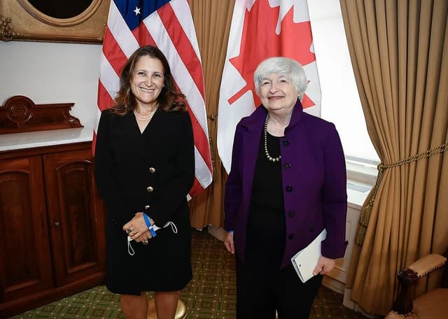 Janet Yellen, US Treasury Secretary, and Chrystia Freeland, Canadian Deputy Prime Minister, standing together.
