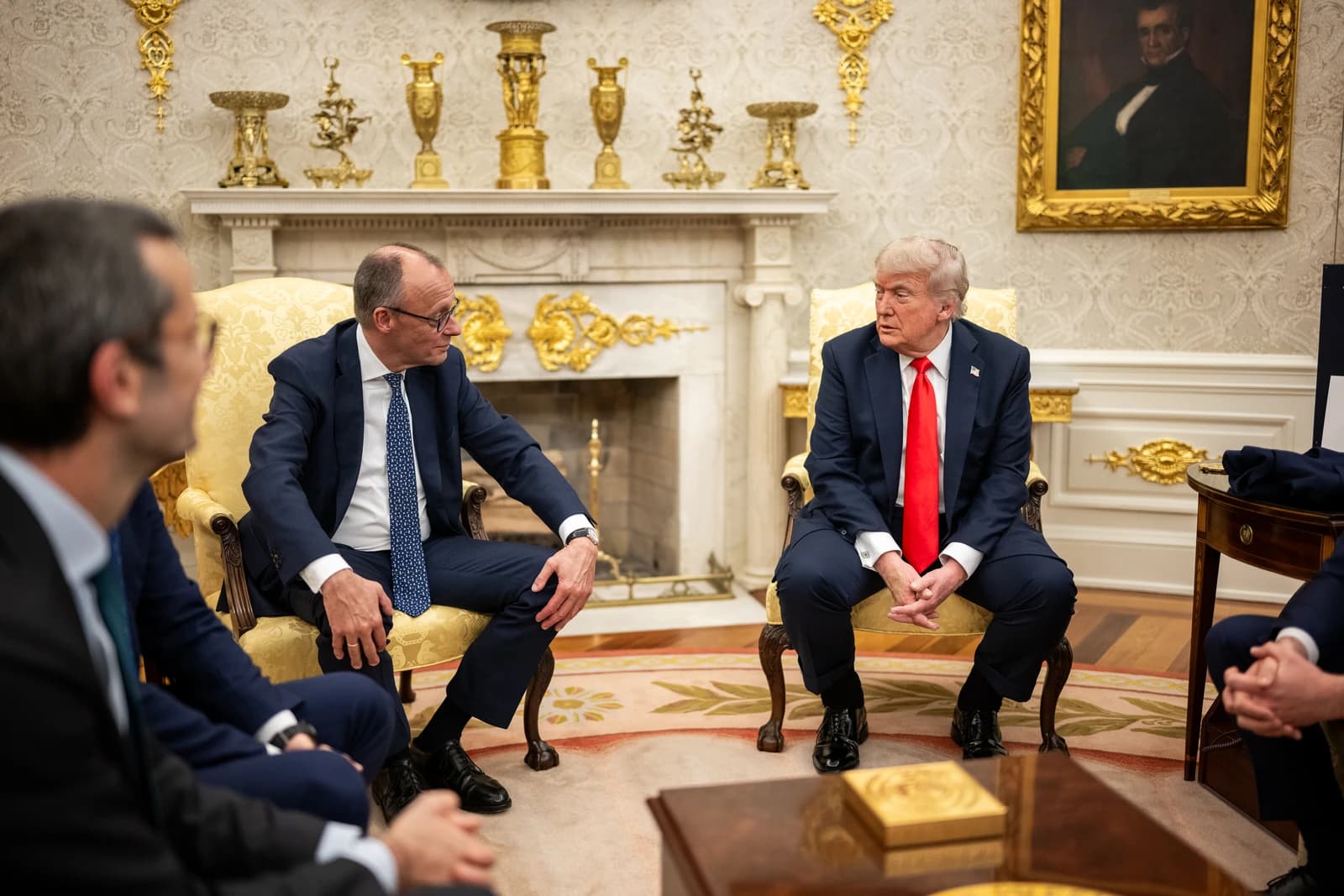 President Donald Trump and German Chancellor Friedrich Merz sit during a bilateral meeting.