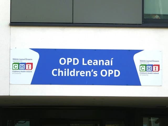 A blue and white sign for Children's OPD at Connolly Hospital in Blanchardstown.