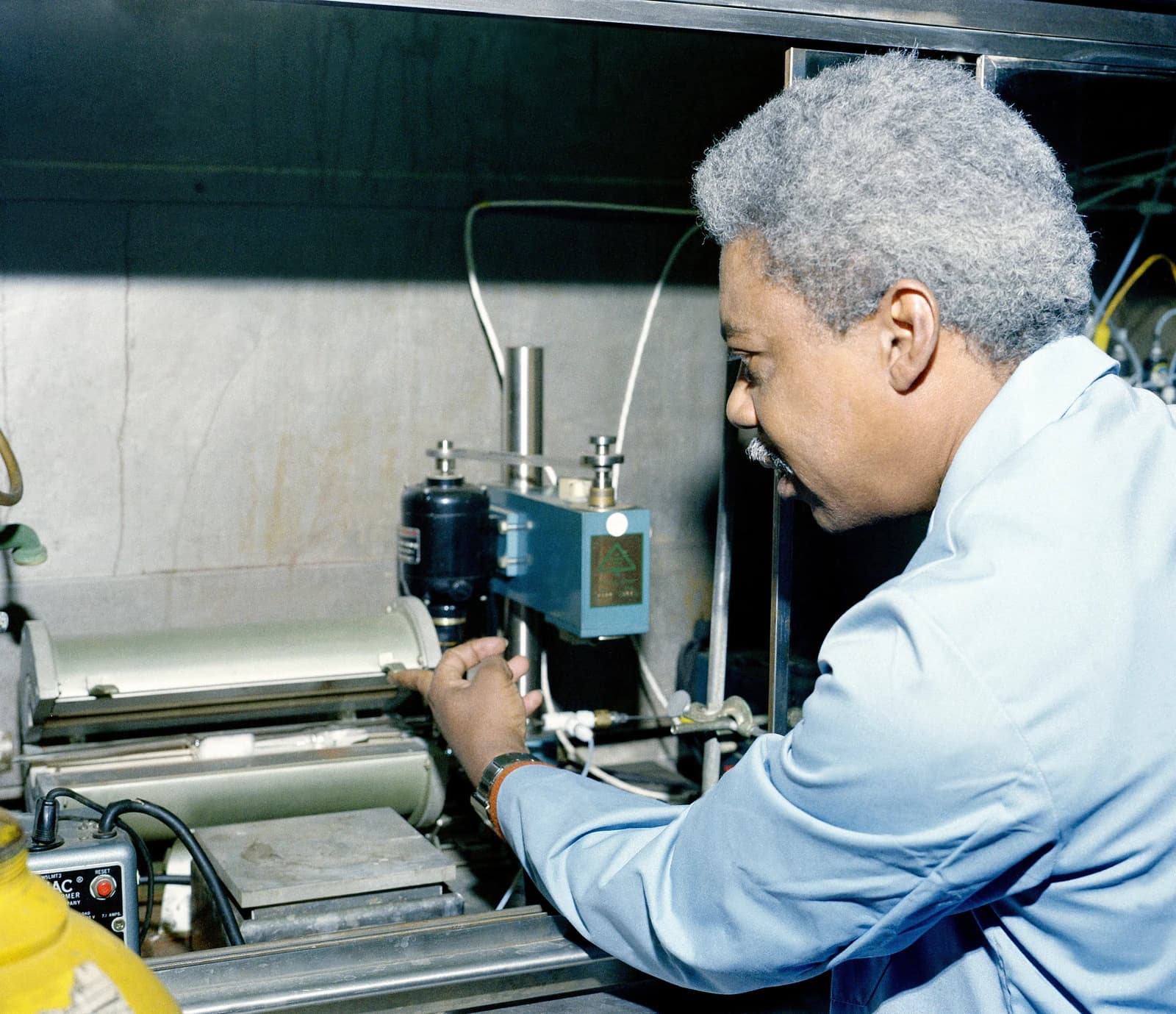 A research chemist monitors test equipment at the U.S. Army Electrical Power Laboratory.