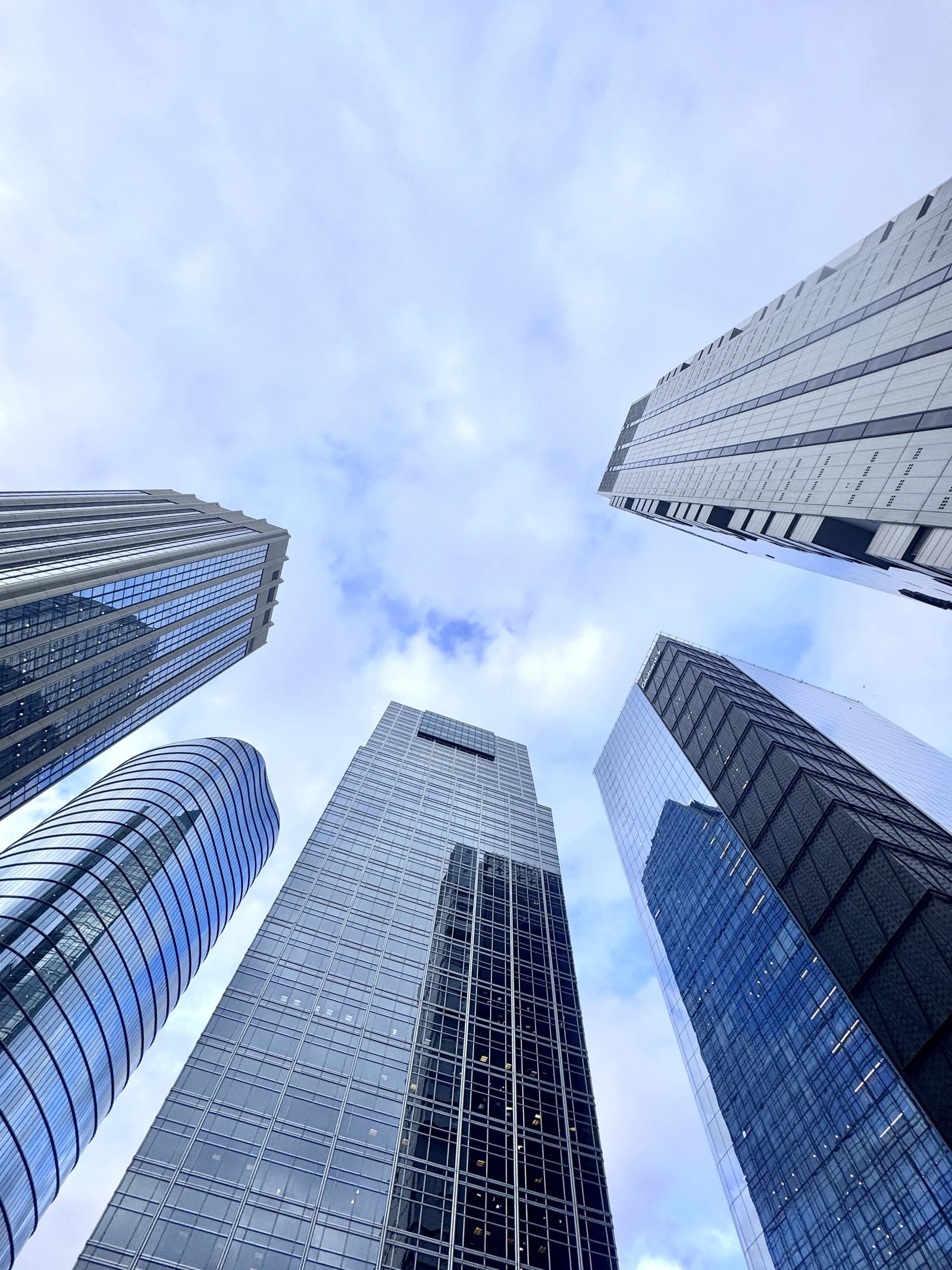 Modern skyscrapers in Buenos Aires' financial district reach into a cloudy sky.