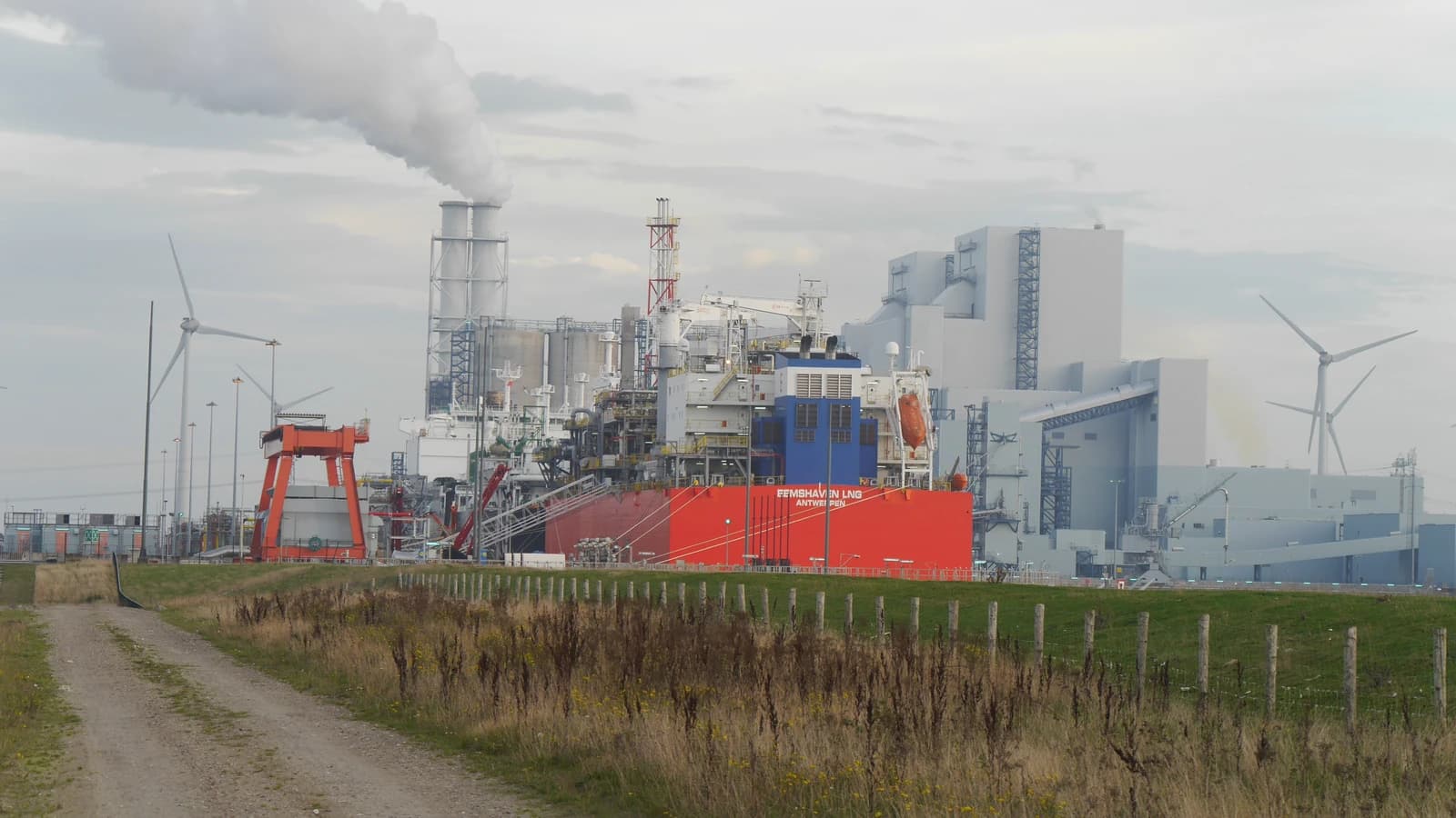 LNG terminal ship Eemshaven LNG at the Wilhelmina harbour in the Netherlands, with industrial facilities.