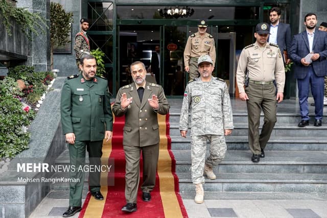 Iranian Minister of Defense with General Abdul Karim Mahmoud Ibrahim at a meeting.
