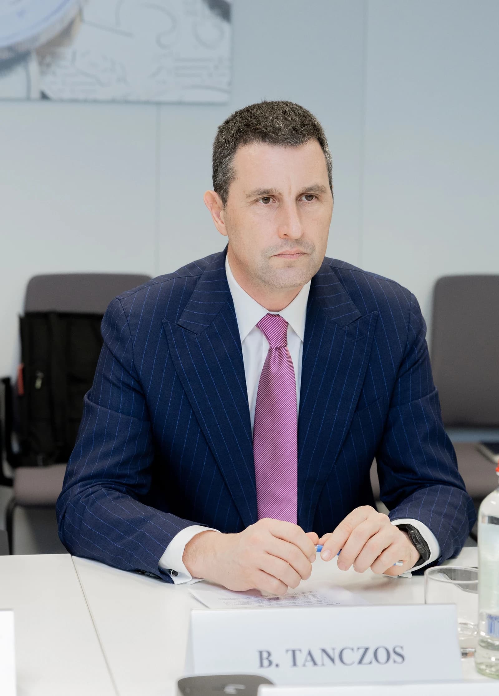 Barna Tánczos, Romanian Deputy Prime Minister and Minister for Finance, seated at a table.