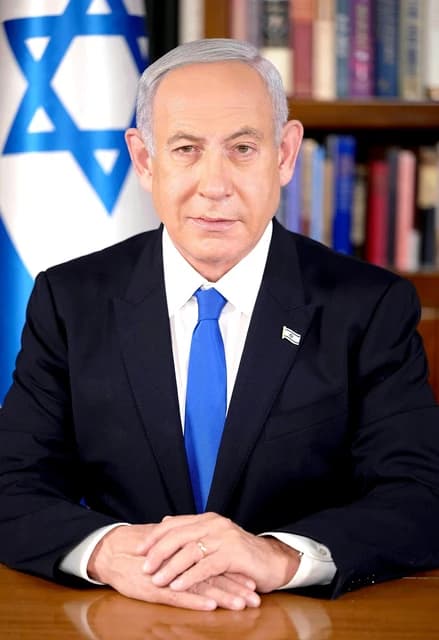 Benjamin Netanyahu, Prime Minister of Israel, sitting at a desk.