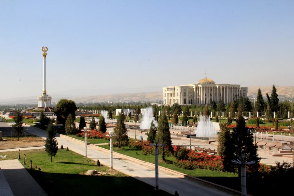 View of the Palace of Nations in Dushanbe, Tajikistan, with fountains and gardens.