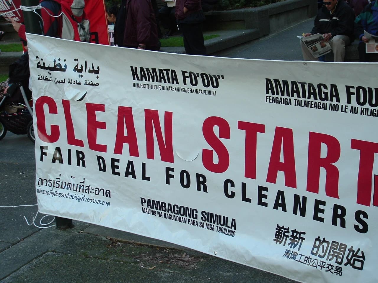 A white banner with red and black text, reading 'Clean Start Fair Deal for Cleaners'.