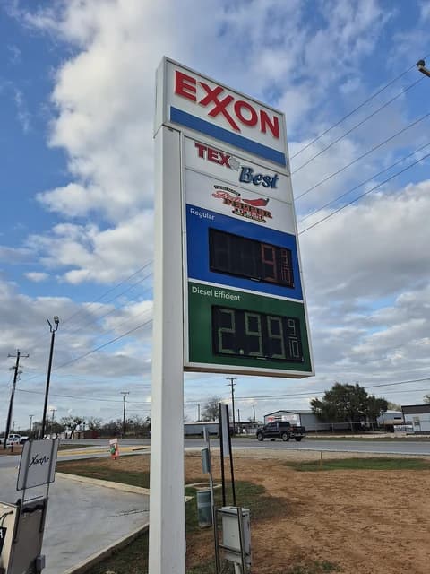 Exxon gas station sign showing prices for regular and diesel fuel.
