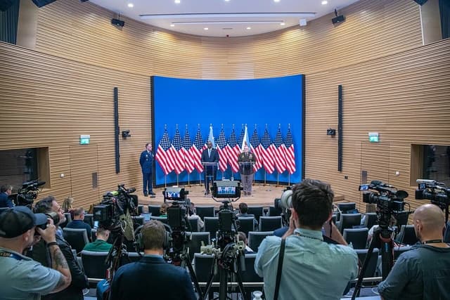 General Mark Milley and Secretary Lloyd Austin speak at a press conference at NATO Headquarters.