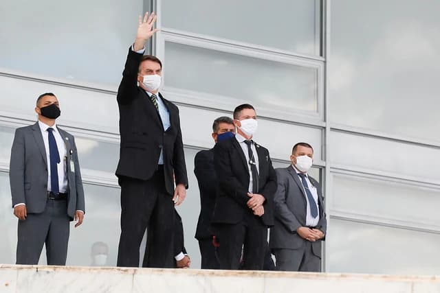 Jair Bolsonaro, President of Brazil, waves from the ramp of the Palácio do Planalto.