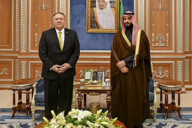 Secretary of State Mike Pompeo meets with Saudi Crown Prince Mohammed bin Salman indoors.