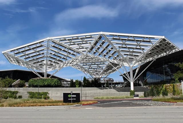 The NVIDIA headquarters building in Santa Clara, California, with a large, white, geometric canopy.