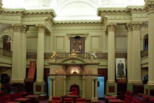 Legislative Council Chamber interior at Parliament House in Victoria, Australia, with ornate columns.