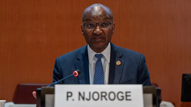 Patrick Njoroge, former Governor of the Central Bank of Kenya, speaking at a microphone.