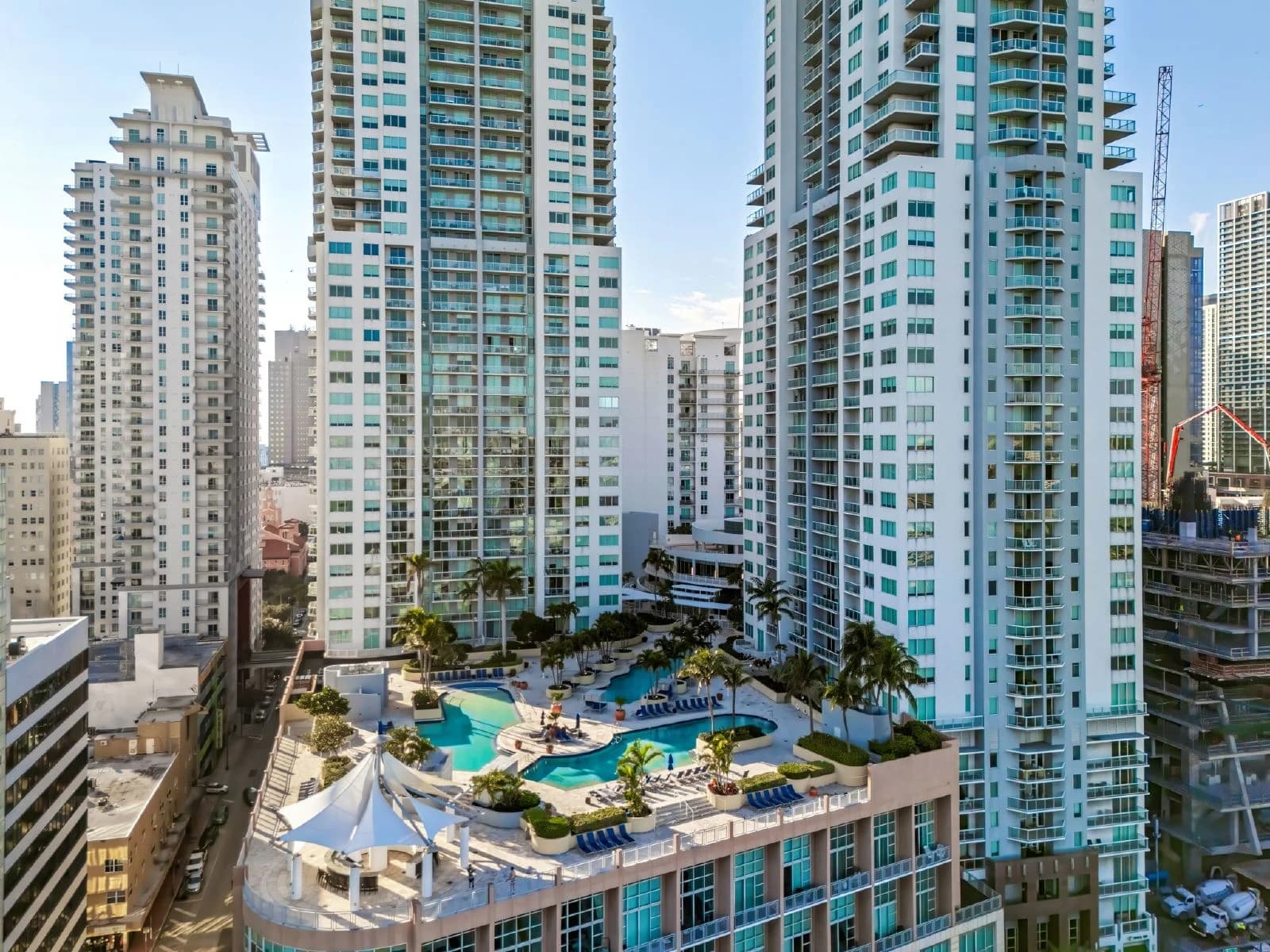 Aerial view of Brickell Miami high-rise condominium pool deck with skyscrapers.