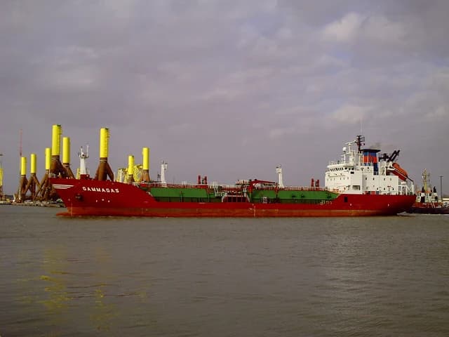 The Gammagas ship, a red and green LNG carrier, on the water.