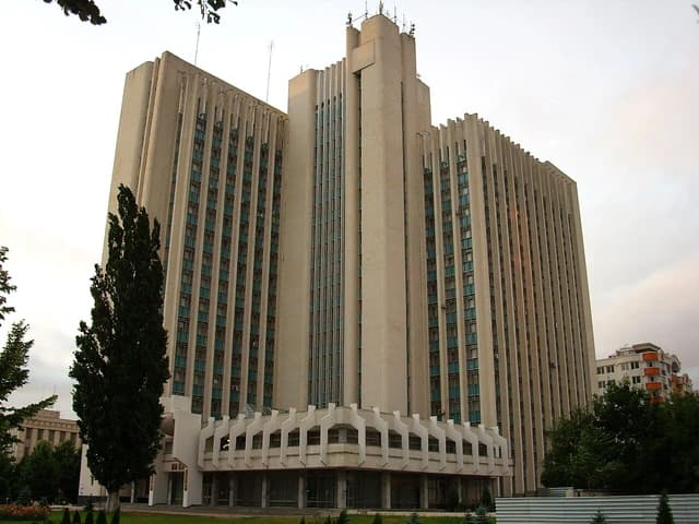 Exterior view of the Chisinau Government Building, a tall concrete structure.