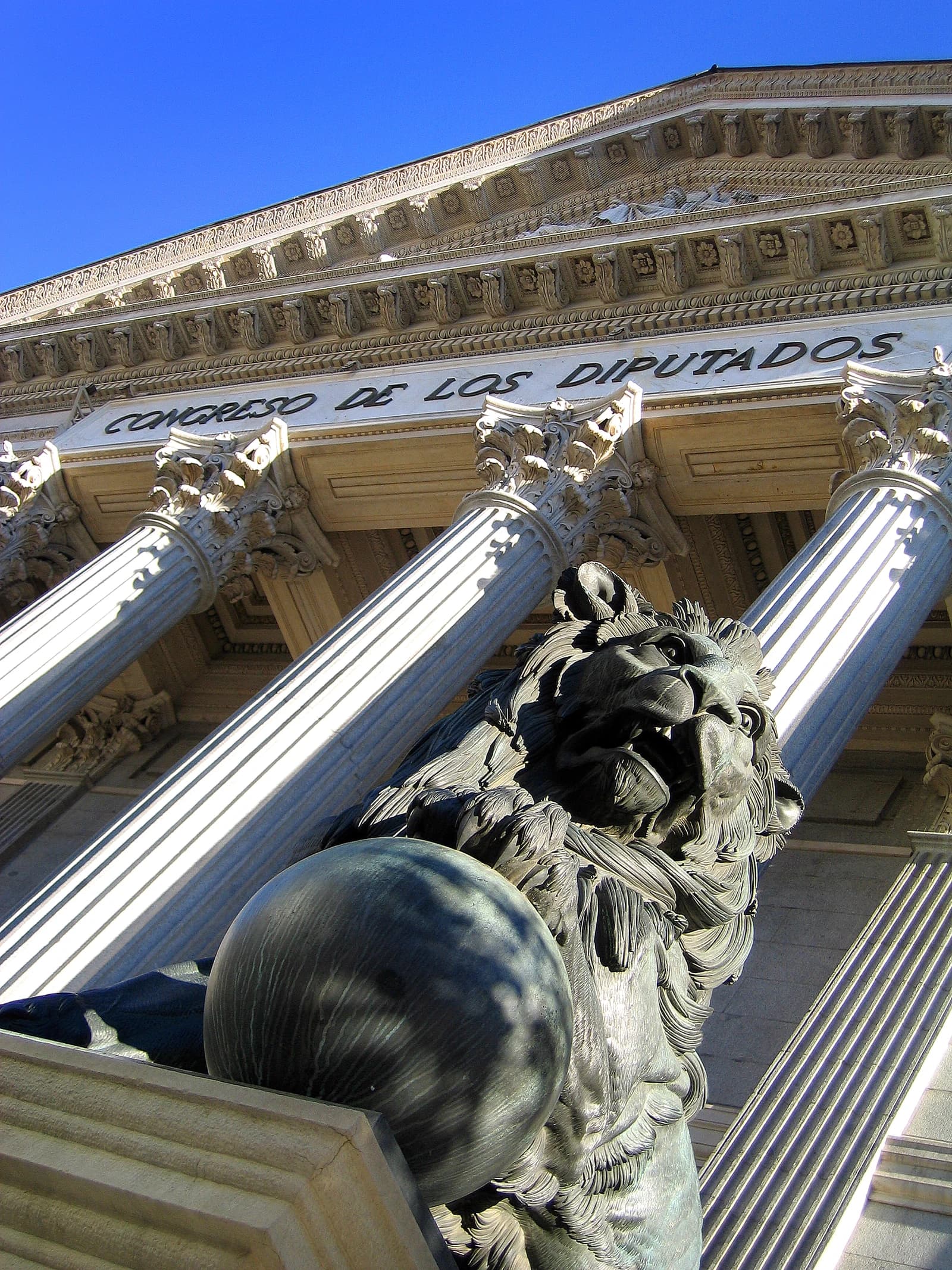 Lion statue in front of the Congress of Deputies building in Madrid, Spain.