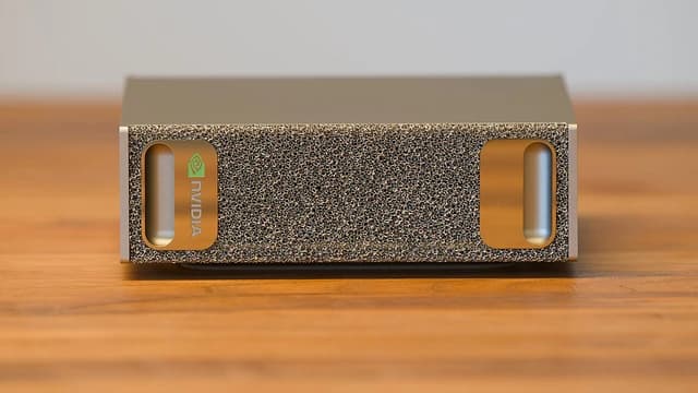 Front view of an Nvidia DGX unit, displaying the Nvidia logo on its side.
