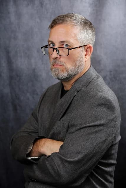 Cris Thomas, known as Space Rogue, an American hacker, looking towards the camera.