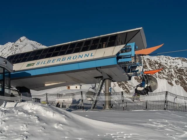 Ski lift station at Soelden ski resort in the Alps on a sunny day.